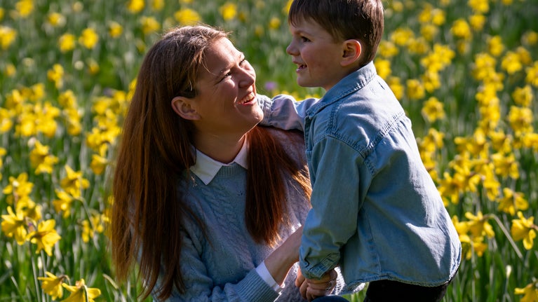 A family enjoying the daffodils in spring